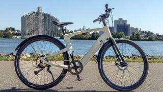 Urtopia Carbon 1 Pro electric bike by a lake in the sunshine