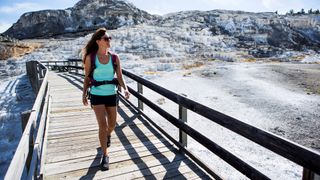 a photo of a woman hiking in Yellowstone National Park