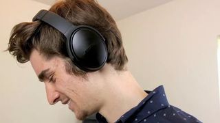 Wearing the Bose QC35 II.