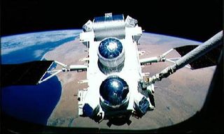 NASA astronauts deploy the Compton Gamma Ray Observatory in during the STS-37 shuttle mission in April 1991.