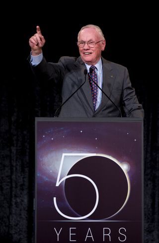Astronaut. Professor. United States Naval Aviator. First man on the moon. Neil Armstrong, a man who is all these things, addresses guests at NASA's 50th anniversary celebration in 2008.