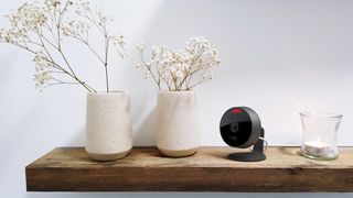 Logitech circle view camera on a wooden shelf