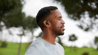 Shokz OpenFit on a man playing sports