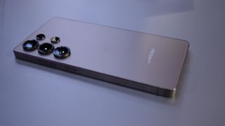 Samsung Galaxy S25 Ultra angled on a gray table.