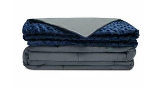 Best weighted blankets: the Quility Weighted Blanket in blue with a reversible grey side