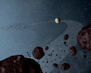 An artist&#039;s depiction (not to scale) of the Trojan asteroids clumped ahead of and behind Jupiter.