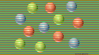 12 spheres sit on a field of green, red and blue stripes, with some stripes crossing in front of the spheres