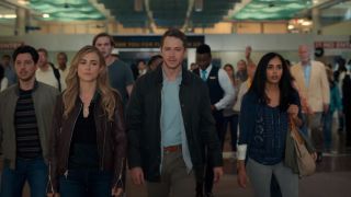 Michaela, Ben, TJ, Saanvi, and other passengers walking through the airport in 2013.