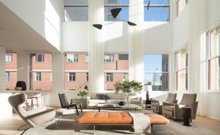 living space with sofa set and plant pot on table