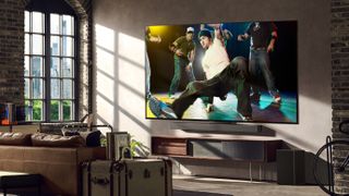 LG G3 OLED TV in a modern apartment living room with a break dancers on screen