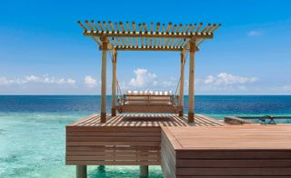 day bed on the water deck at Waldorf Astoria