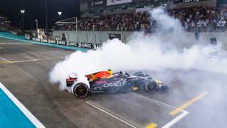 Red Bull F1 car doing doughnuts on the track