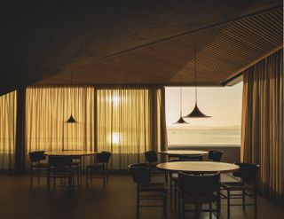 The Cantabrian Maritime Museum Restaurant interior during golden hour