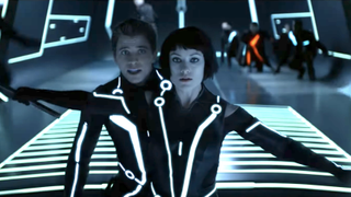 olivia wilde protecting garrett hedlund in tron: legacy