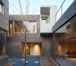 Courtyard of multigenerational house, Residence of Three Generations, Hong Kong (2019), designed by MINORlab