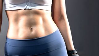 a photo of a woman&#039;s toned core