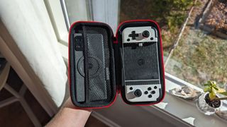 A GameSir X2 controller in its carrying case with a Motorola Edge Plus (2023) inside the carrying pouch