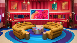 Sneak peak inside the Big Brother U.K. 2024 house featuring a mustard circular couch and large TV screen