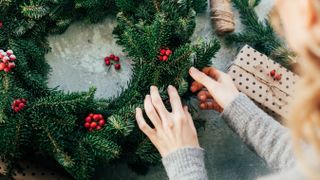 Woman making a Christmas wreath