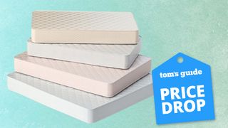 4th of July mattress sales 2024 image shows a stack of hybrid, memory foam and latex mattresses placed on top of each other on a teal-coloured background and with a blue price drop deals badge overlaid in the bottom right hand corner