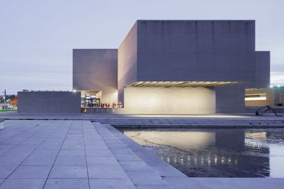 everson museum of art east wing redesign by MILLIONS concrete geometric volumes and colourful soft interiors and planters