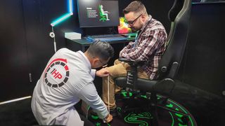 Dr. Hwu measuring leg length for the Razer Iskur V2