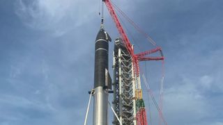 SpaceX stacks its SN20 Starship prototype atop its Super Heavy booster for the first time at the company&#039;s Starbase facility in South Texas in August 2021.