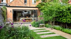 Garden with paving stones and wild plants