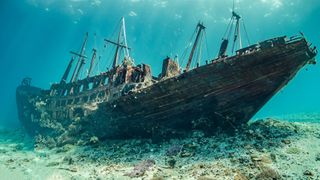 An artist&#039;s rendering of a grand shipwreck on the floor of the ocean