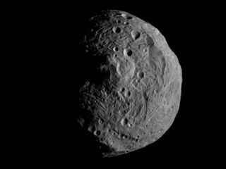 Small grey cratered asteroid, Vesta.