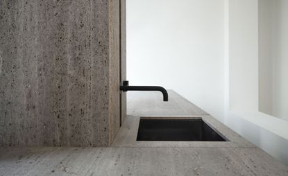 Belgian architect Glenn Sestig has yet again conjured up magic with natural stone travertine titanium, this time transforming it into a &#039;Signature Kitchen&#039; for Obumex