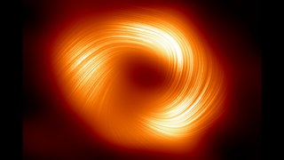 Striations are seen on a blurred glowing red-orange ring in space.