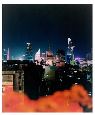 The cityscape as seen from The View’s rooftop bar, with, far left, in pink, Landmark 81, at 461m the country’s tallest skyscraper; centre, in white, César Pelli’s Vietcombank Tower, and far right, with a cantilevered helipad, Carlos Zapata’s Bitexco Financial Tower