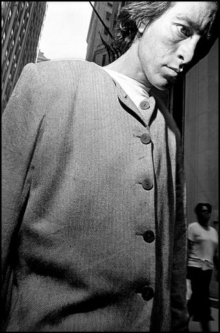 USA. New York City. Man walking in Wall Street area. September 18th, 2001, by Bruce Gilden