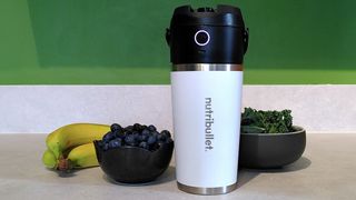 Nutribullet Flip blender on kitchen counter with fruit