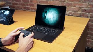 Someone playing an AAA game on a Mac.