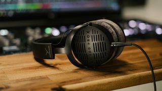 Beyerdynamic DT 900 Pro X on a wooden desktop