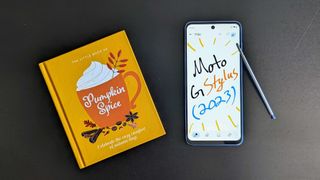 Moto G Stylus (2023) next to a book