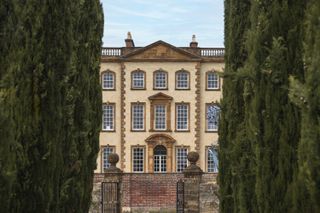 views of the sherborne in dorset with historical facade and modern rooftop addition