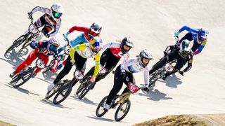 A group of riders round a berm BMX Racing ahead of the 2024 Paris Olympic Games.