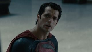 Henry Cavill speaking as he stands in the train station in Man of Steel.