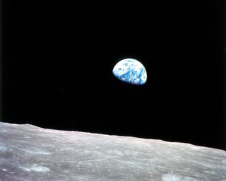 Taken aboard Apollo 8 by Bill Anders, this iconic picture shows Earth peeking out from beyond the lunar surface as the first crewed spacecraft circumnavigated the Moon, with astronauts Anders, Frank Borman, and Jim Lovell aboard.