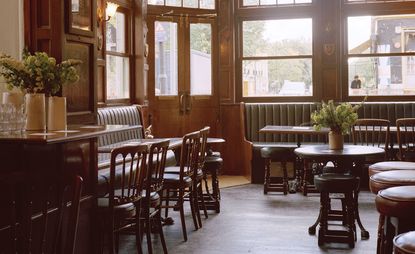 Restaurant with wood paneling and leather banquettes