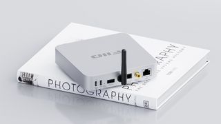 Fiio SR11 in white on a photography book