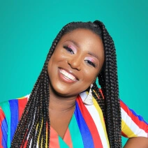 picture of a woman with dark hair smiling with a stripy colorful top on