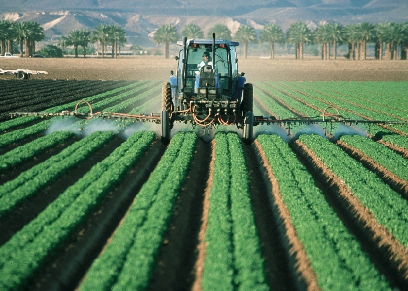 A tractor on a green field