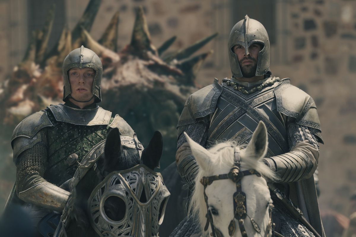 Ser Criston Cole and another soldier ride into town towing a dragon head behind them in season 2 of House of the Dragon.