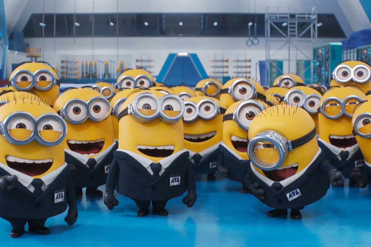 A group of Minions in suits and ties, laughing in an office