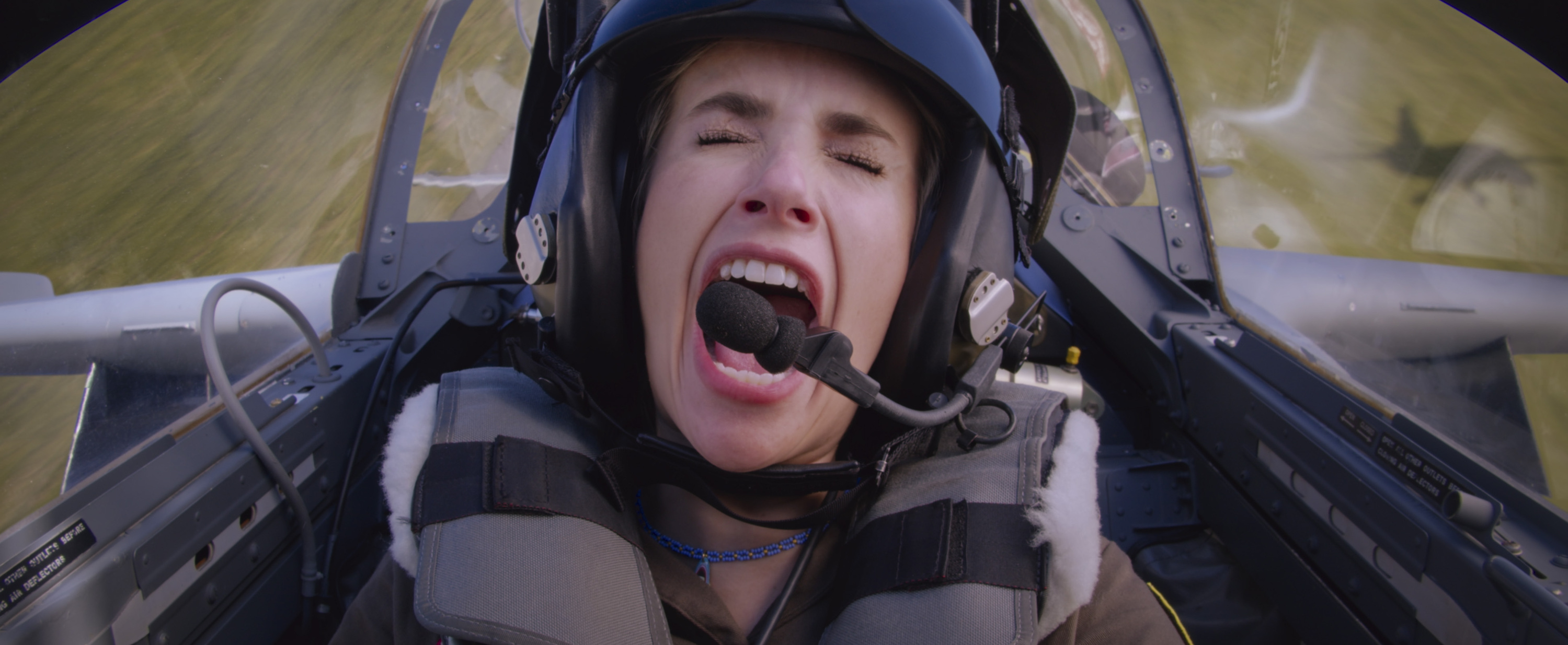 A woman in the cockpit of a fighter jet screaming in Space Cadet.