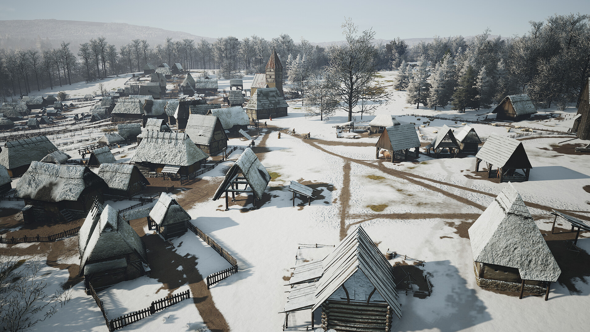 A snowy village of simple huts with a church in Manor Lords
